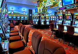 Filipino player spinning slot games on a mobile phone with panalo play